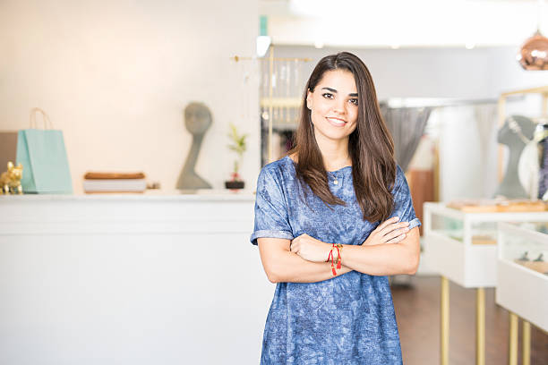 latin business owner in a jewelry store - owner boutique store retail imagens e fotografias de stock