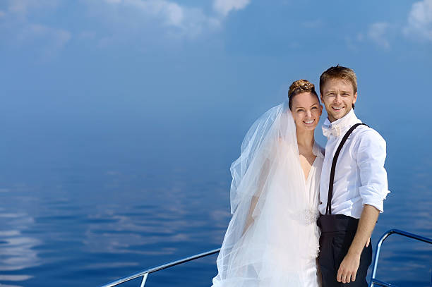 istock Happy bride and groom on a yacht 622035300