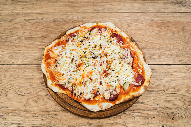 istock Italian pizza with pickles salami and cheese 622035730