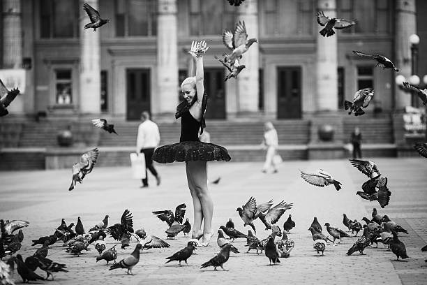 istock Ballerina posing among birds 622036892