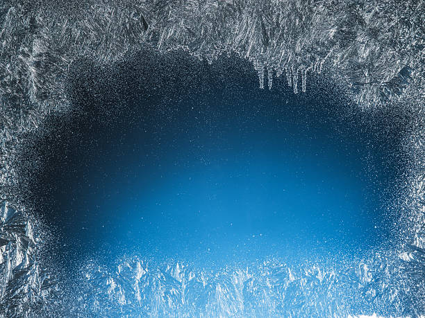 istock Wooden sill and frozen window. 622038048