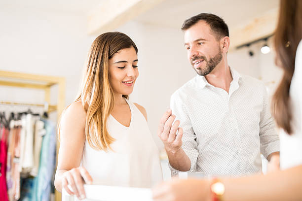 istock Cute couple buying a diamond ring 622038160
