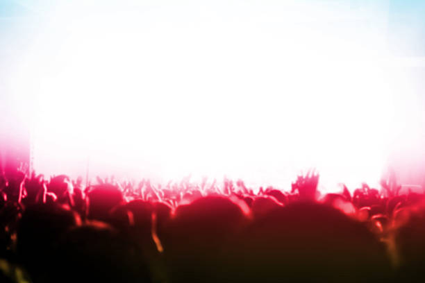 Blurred background : Bokeh lighting in outdoor concert with cheering audience