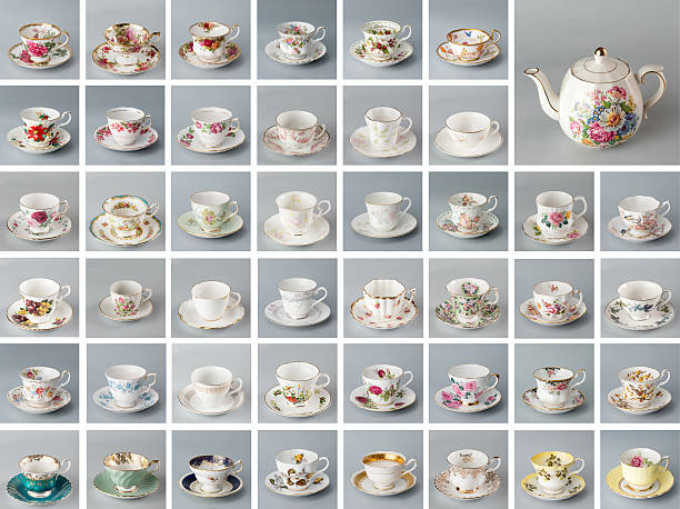 Antique English teacups and teapot Antique English teapot on the background of many antique bone china teacups. tea cup and saucer stock pictures, royalty-free photos & images