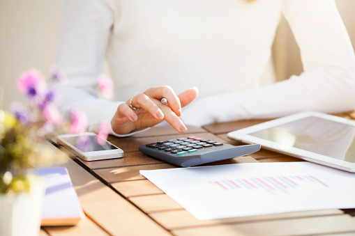 Businesswoman using calculator