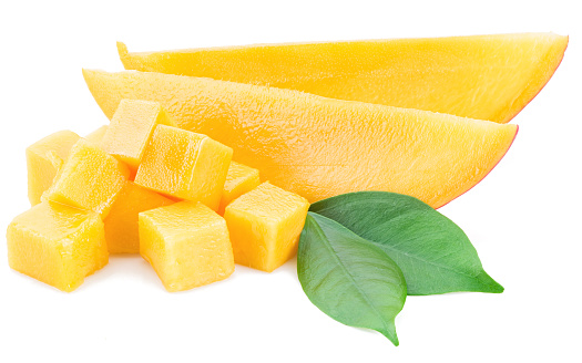 Mango cubes and slices on a white background.