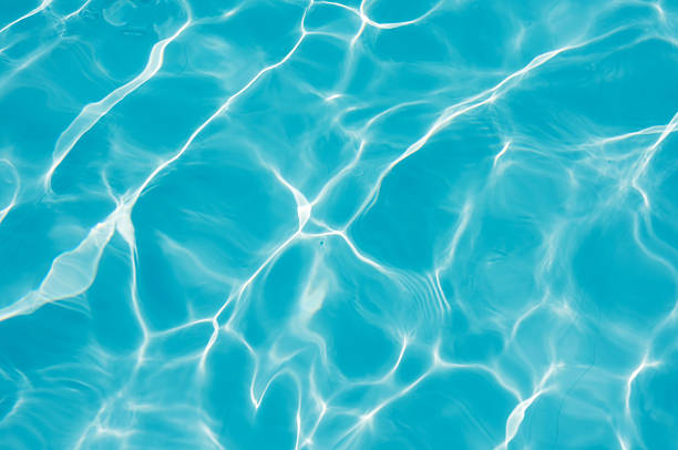 istock Closeup blue water surface in swimming pool 622049238