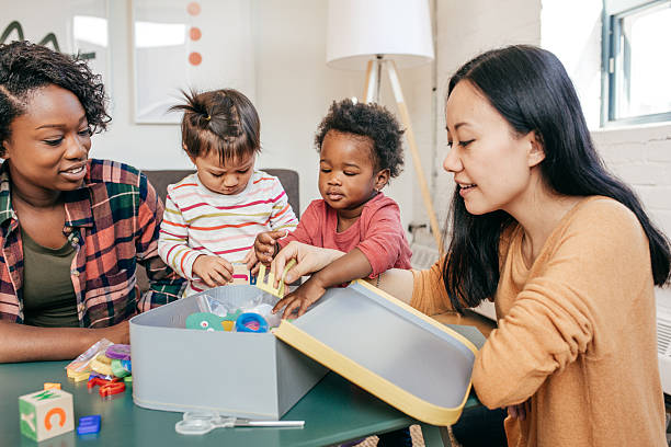 istock Toddlers and mothers playing together 622051088