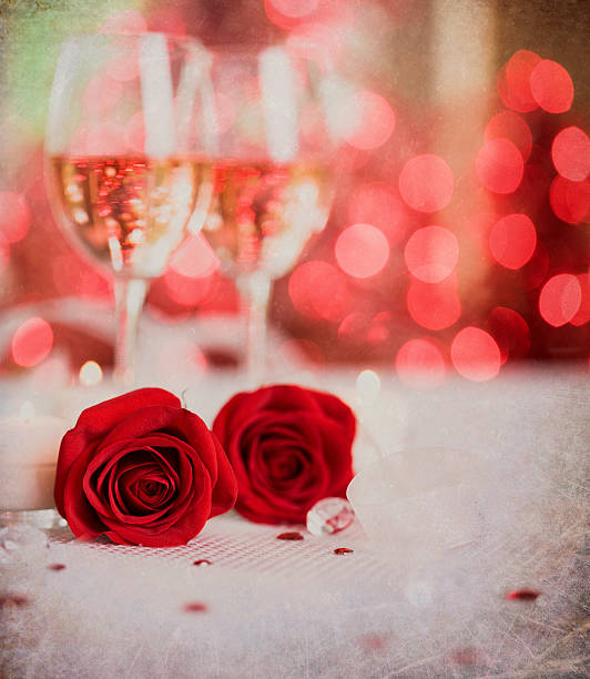 istock Valentine's Day White Wine and Red Roses with Defocused Lights 622051312