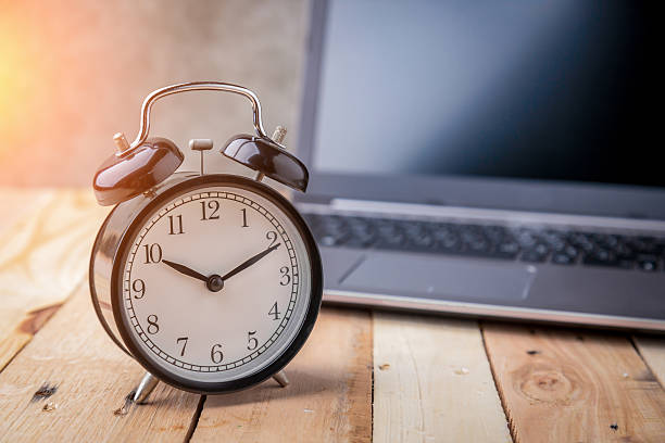 istock business schedule concept with black alarm clock with blank scre 622053546