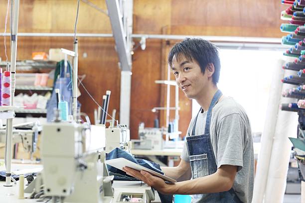 istock The tailor who revises a design of the denim 622054464
