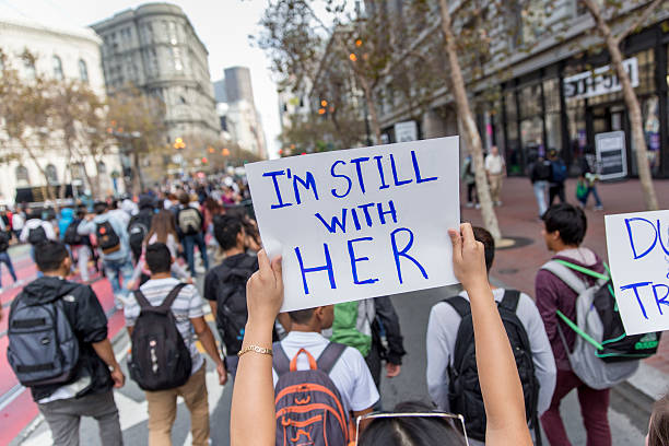 Trump-Protest San Francisco, United States - November 10, 2016: Thousands of San Francisco high school students walking out of class and marching to protest Donald Trump winning the presidency. hillary clinton stock pictures, royalty-free photos & images