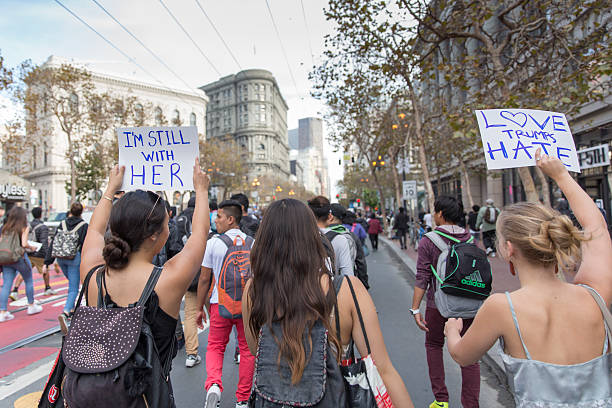 Trump-Protest San Francisco, United States - November 10, 2016: Thousands of San Francisco high school students walking out of class and marching to protest Donald Trump winning the presidency. hillary clinton stock pictures, royalty-free photos & images
