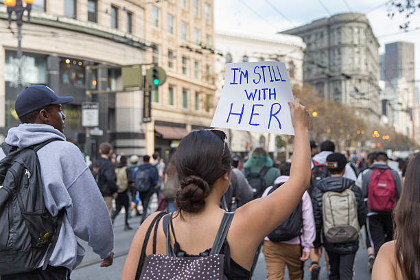 Trump-Protest San Francisco, United States - November 10, 2016: Thousands of San Francisco high school students walking out of class and marching to protest Donald Trump winning the presidency. hillary clinton stock pictures, royalty-free photos & images