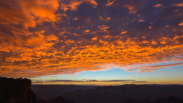 Golden clouds before sunrise over Copper Canyon, Sierra Madre Occidental, Chihuaha, Mexico.