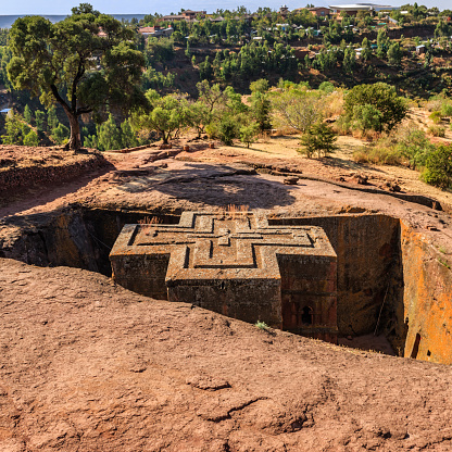 Church of Saint George is the most well known and last built of the eleven rock-hewn churches in the Lalibela area. Bete Giyorgis is carved from solid red volcanic rock in the 12th century, Lalibela. Ethiopia, Africa.