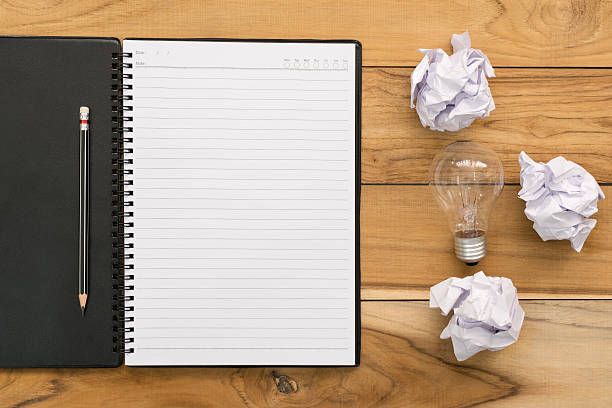 istock notebook and pencil with sheets of crumpled paper .. 622062012