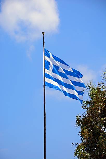 istock Greek flag against a blue sky, Crete. 622062192