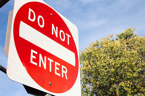 istock Do not enter sign and tree changing colors 622063852