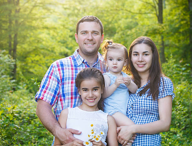 istock Happy young family in the spring forest 622064644