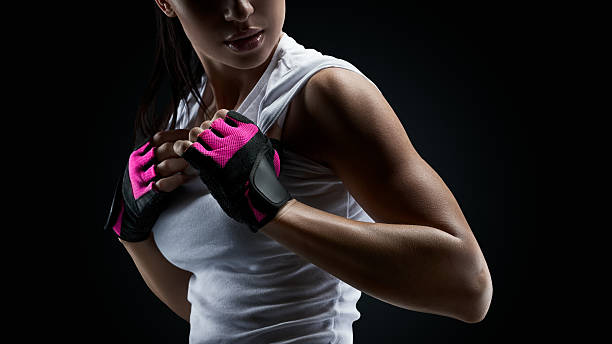 istock Female athlete on black background 622064766