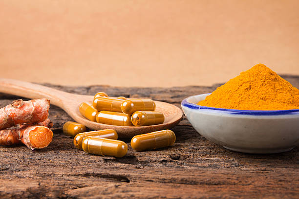 istock the turmeric powder and capsule and roots curcumin 622065412