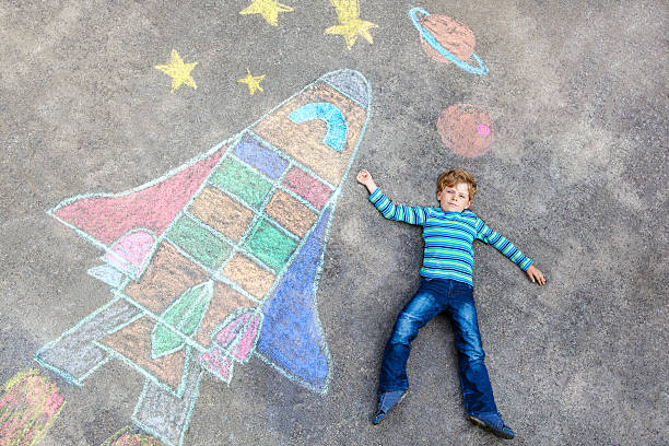 istock little kid boy flying by a space shuttle chalks picture 622067230
