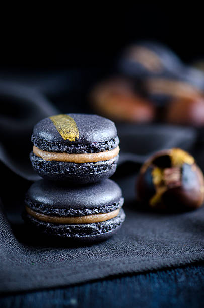 Black macaron with chesnut stock photo