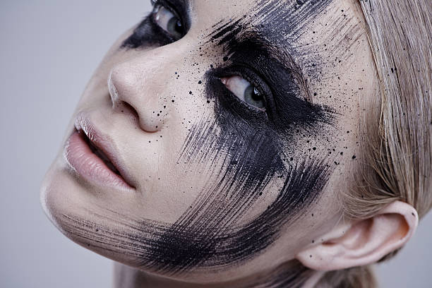 A soft, minimalist black-and-white portrait in an unconventional reclining pose, merging fashion, subculture, and quiet experimental elegance.