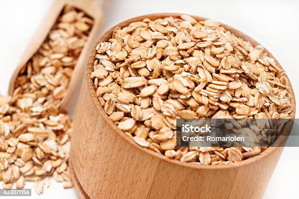 Close Up Of Oatmeal In Bowl And Scoop Stock Photo - Download Image Now - Bowl, Breakfast, Cereal Plant