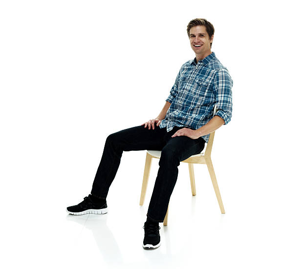 istock Smiling casual man sitting on chair 622072846