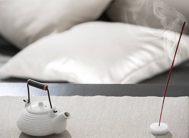 istock Teapot and incense stick on table at relaxation lounge 622074414