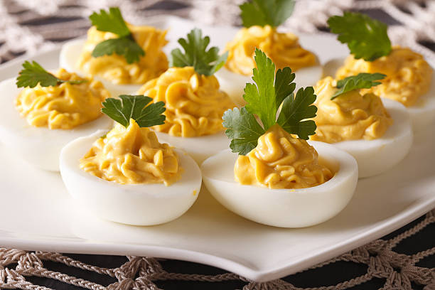 istock Stuffed eggs with mustard and parsley close-up. horizontal 622075920