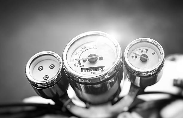 Motorcycle speedometer. Vintage motorbike. Devices on a steering bracket on the old bike.