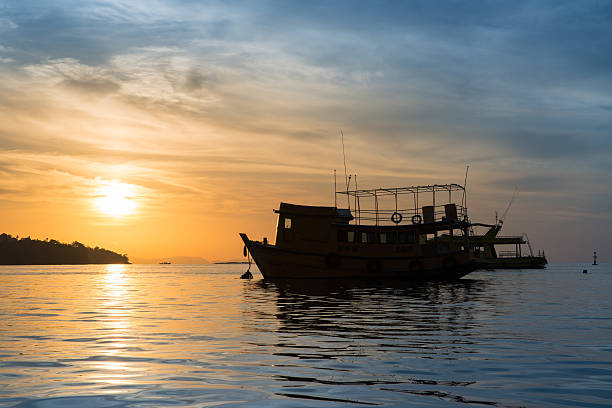 istock Ferry Boat Silhouette with empty passengers at sunrise. 622076168