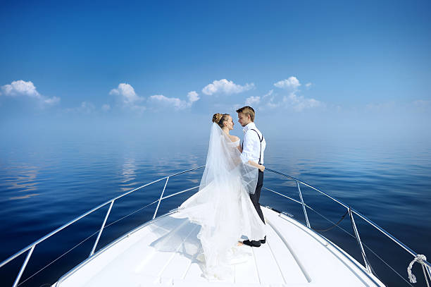 Photo of Happy bride and groom on a yacht