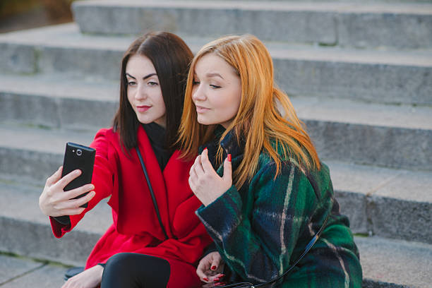 istock Two girls with gadget 622076912