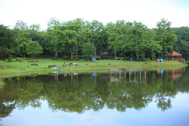 istock Camping Tents and reflection on lake 622076916