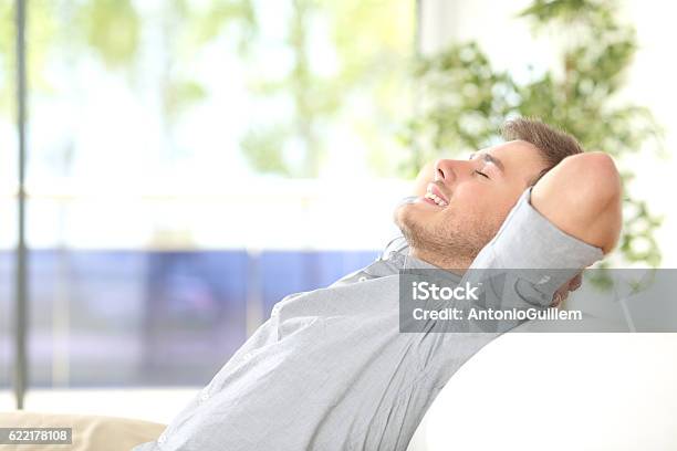 Man Resting And Breathing At Home Stock Photo - Download Image Now - Men, Breathing Exercise, Indoors