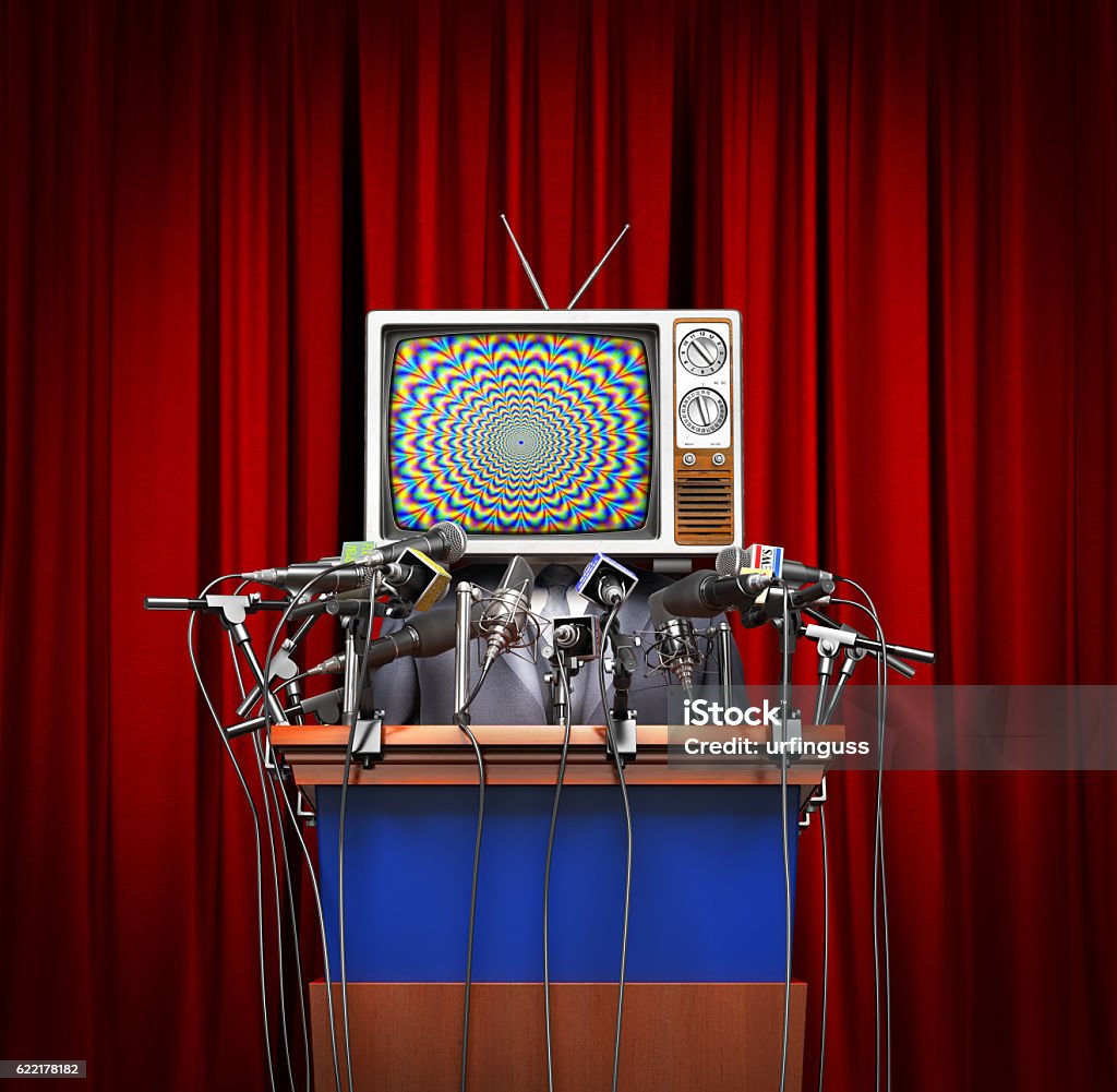 Mass media concept. Mass media concept. Man in a suit and TV instead of head behind a tribune with microphones for conference on a red curtain background. Concept of propaganda. 3d illustration Debate Stock Photo