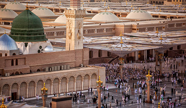 Al-Masjid Al-Nabawi Al-Masjid an-Nabawi was the third mosque built in the history of Islam and is now one of the largest mosques in the world. Photo by Orhan Durgut al masjid an nabawi stock pictures, royalty-free photos & images