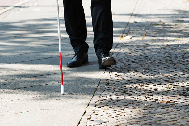 istock Blind Man With White Stick On Street 622181368