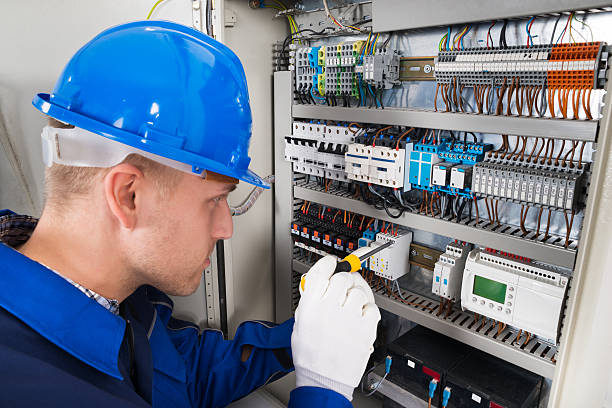 istock Male Electrician Examining Fusebox 622182116