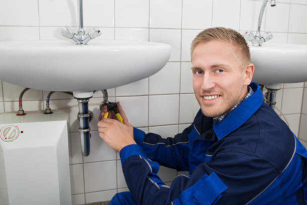 istock Plumber Fixing Sink In Bathroom 622182218