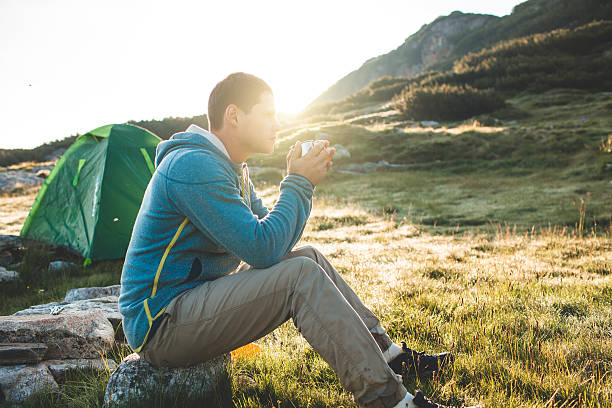 istock Young man drinking tea at the mountain 622182234