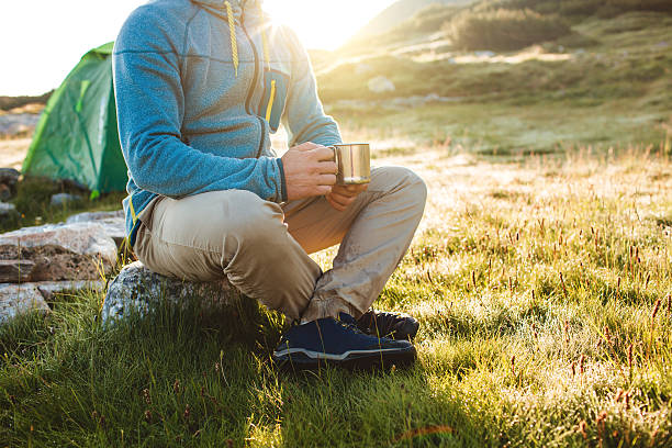 istock Young man drinking tea at the mountain 622182406