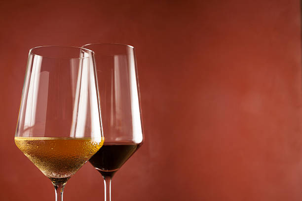 istock Red wine and white wine in glass on left side on frame 622182724