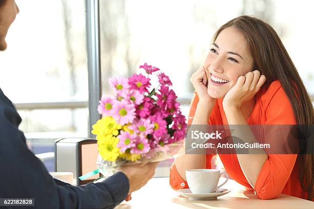 Candid Couple Dating In A Coffee Shop Stock Photo - Download Image Now - Love At First Sight, Flower, Men