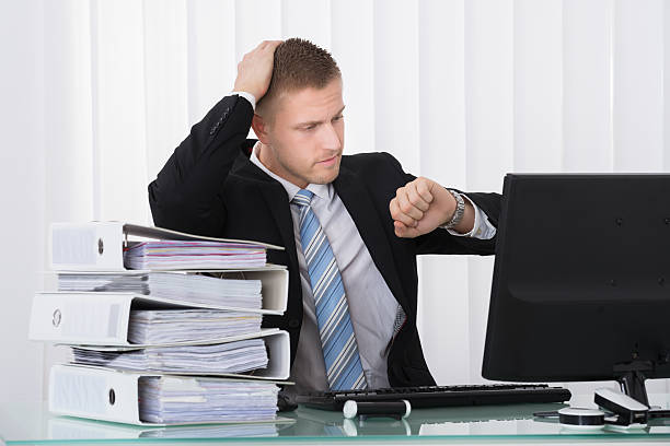 istock Businessman Looking At Watch 622182920