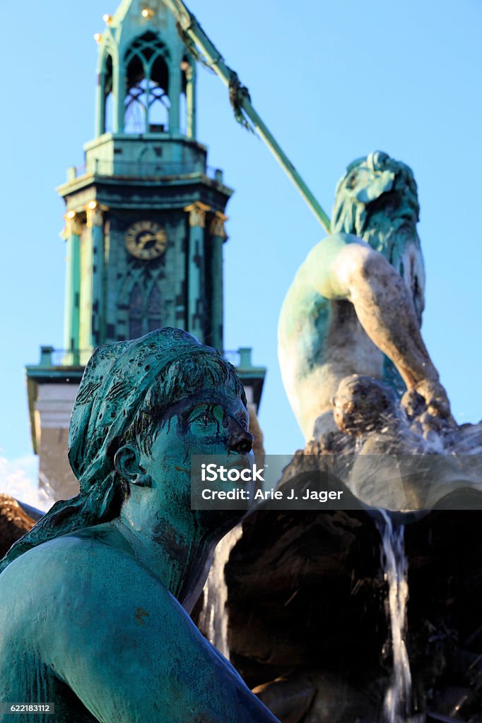 Neptune Fountain in Berlin Neptune Fountain in Berlin. The fountain was built in 1891 and designed by Reinhold Begas. The fountain shows the Roman god Neptune. The women around him represent the four main rivers of Prussia: the Elbe, Rhine, Vistula and Oder; Berlin Germany Berlin Stock Photo